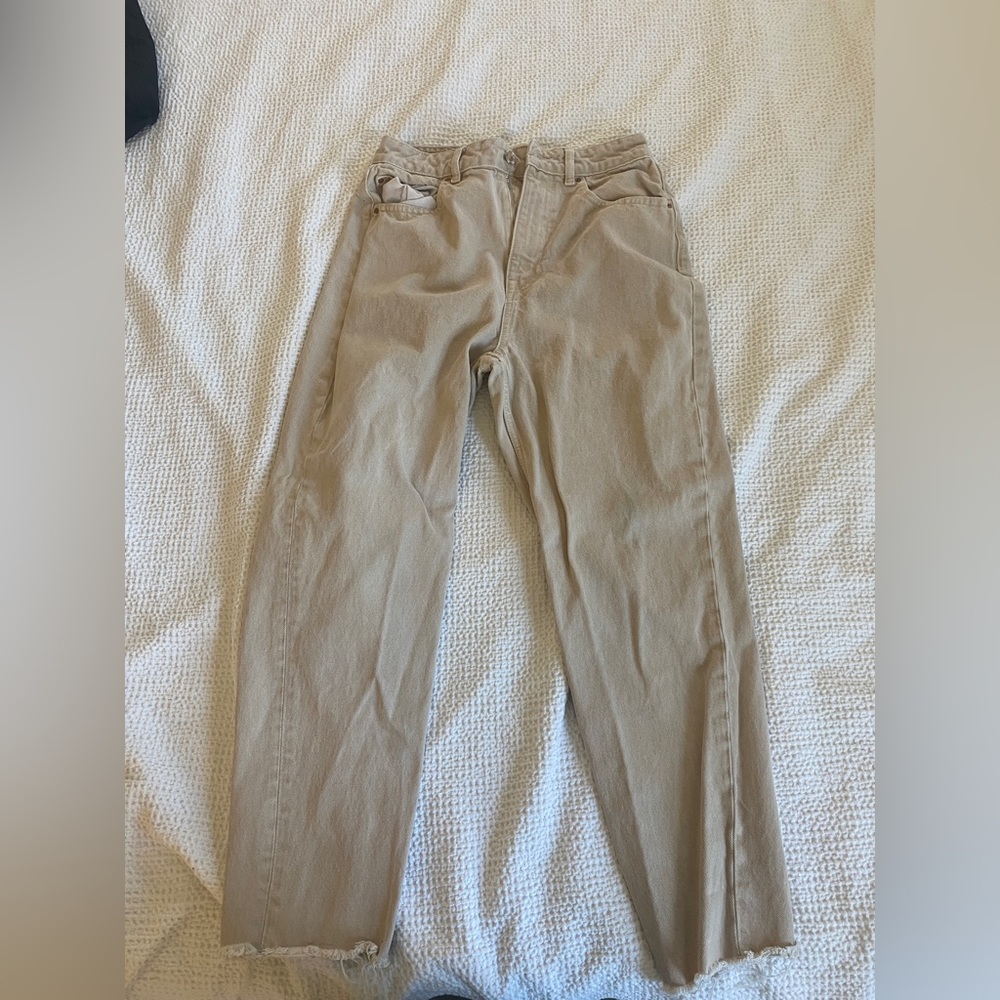 Tan ankle jeans with raw hem